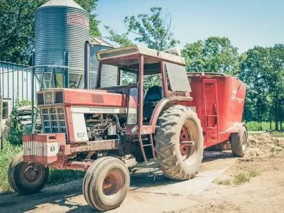 Red tractor with cargo